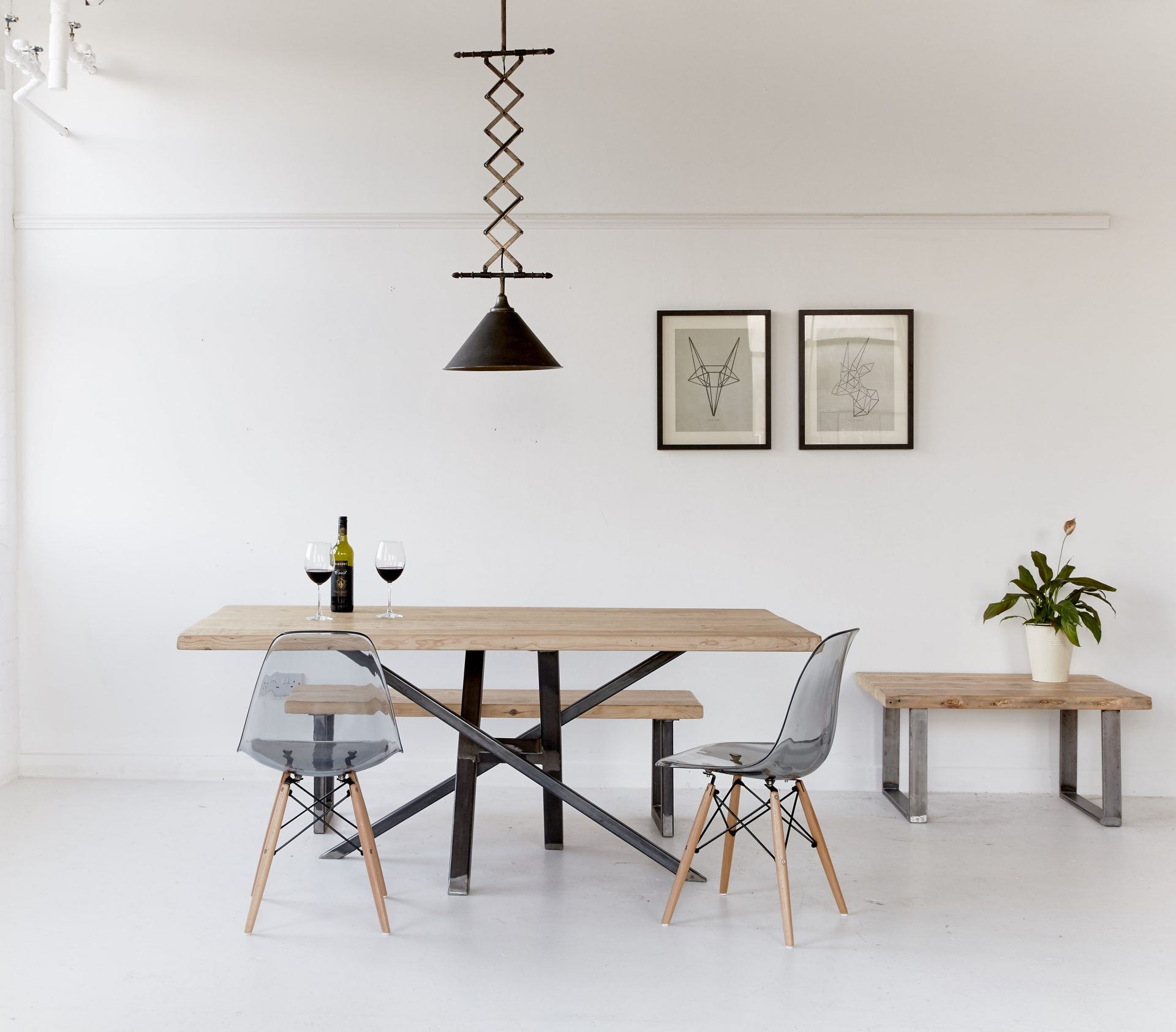 Wood and Metal table complimented by ghost chairs